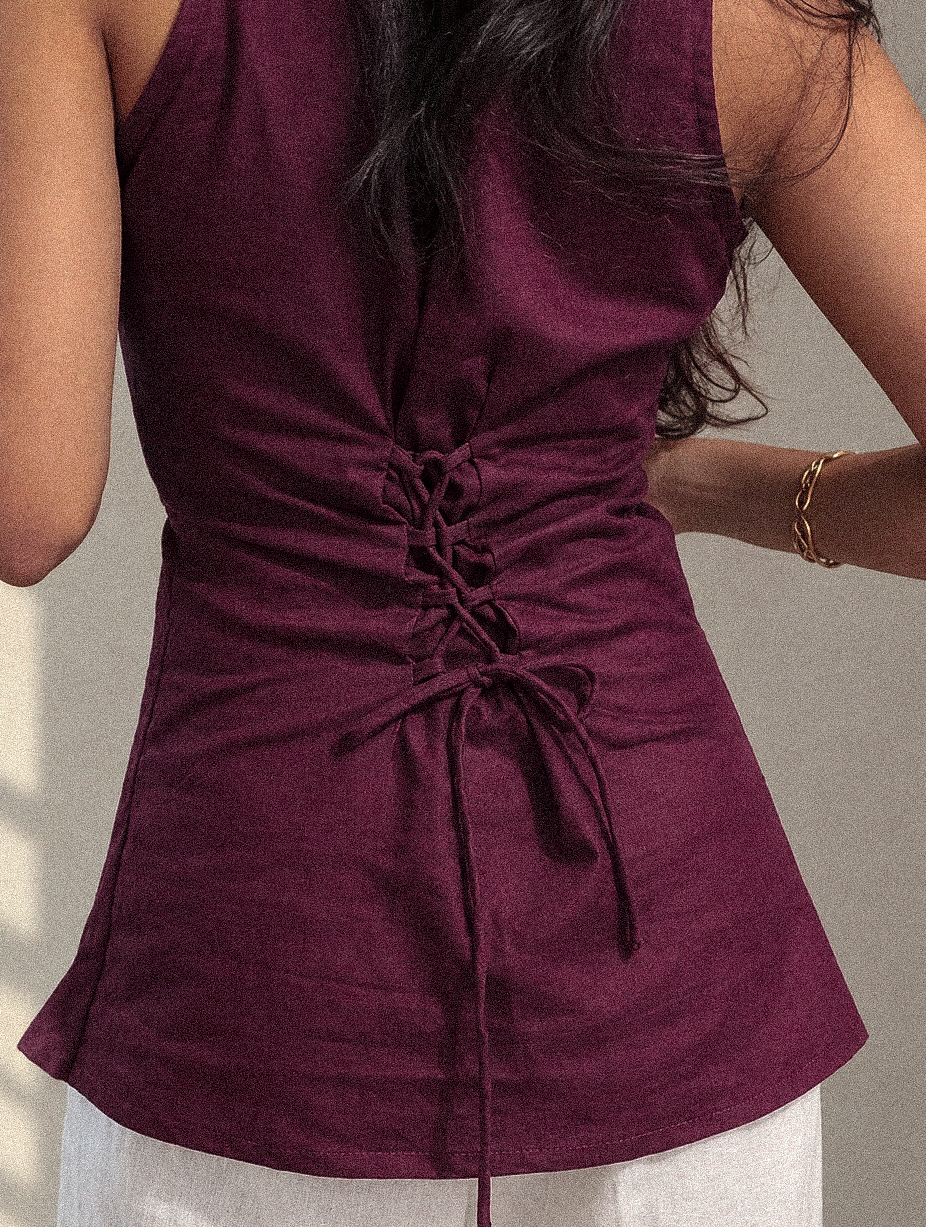 Maroon corset kurti with a gold paisley border, worn with ivory eyelet palazzo